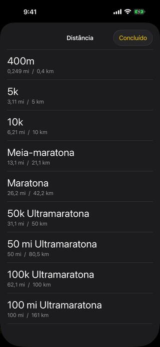 A lista de distâncias de prova: 400m, 5k, 10k, meia-maratona, maratona e as ultramaratonas de 50k, 50 milhas, 100k e 100 milhas, cada uma mostrando milhas e quilômetros.